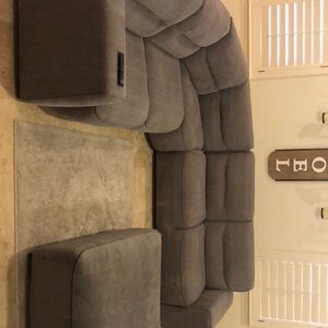 Grey sectional couches & ottoman. Great condition